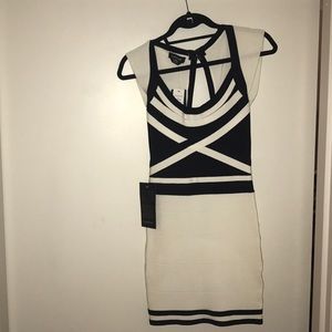 BEBE Black/White High-roller bandage style dress.
